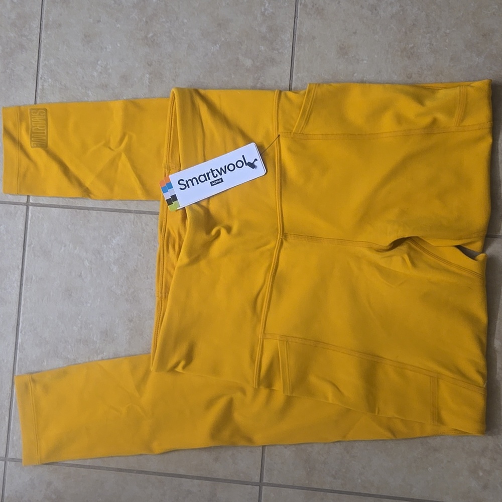 NWT. Smartwool leggings, size M